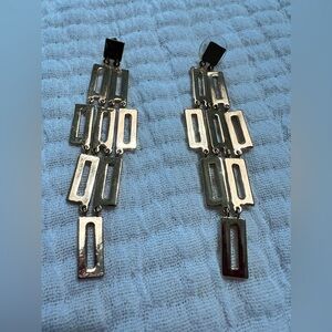 Gold chandelier earrings.